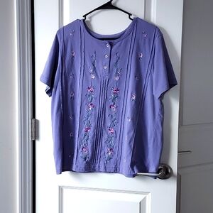 Purple with flower print button up short sleeve top.